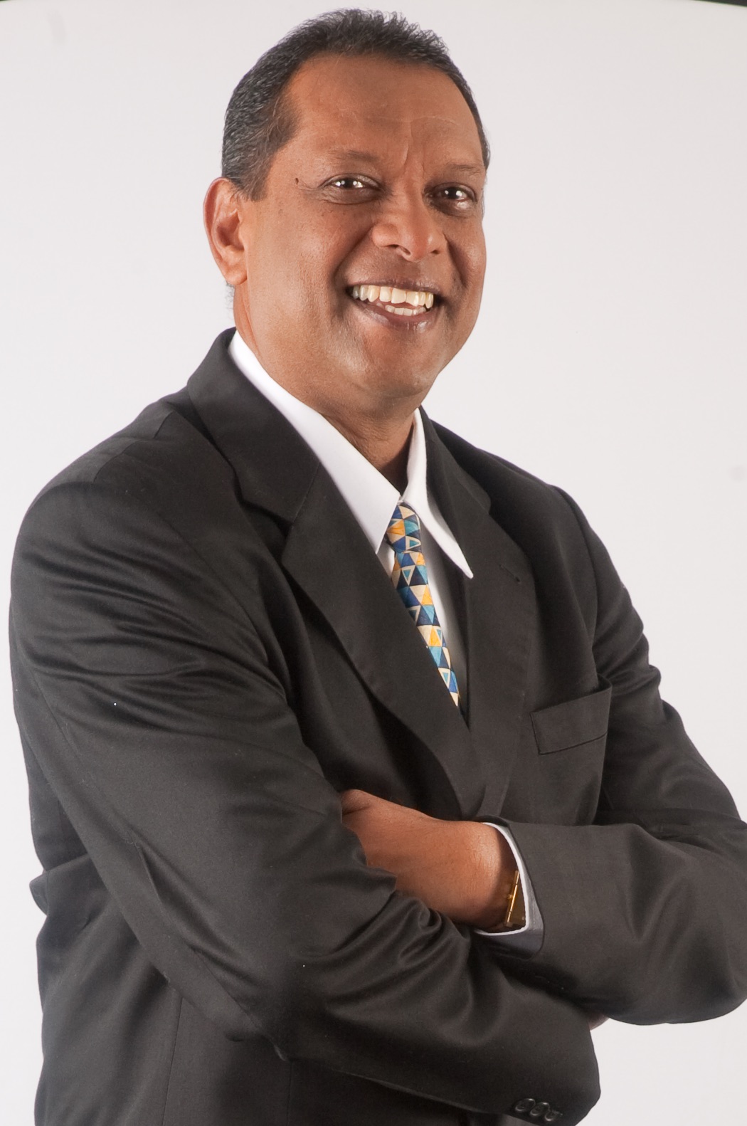 Seeram Ken Maharaj in a formal corporate portrait